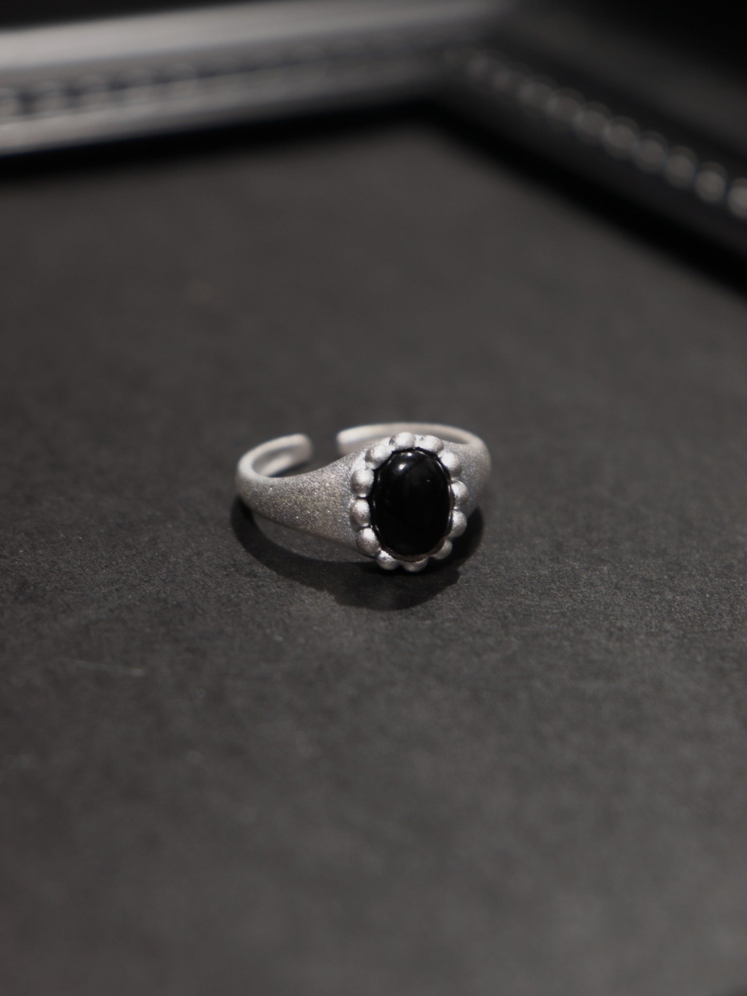 Matt - black stone flower ring